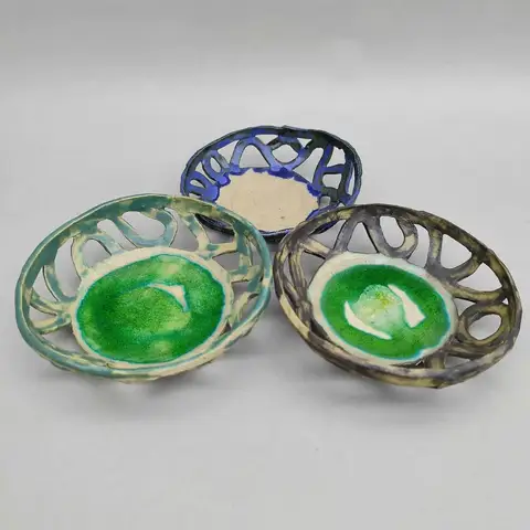 Trio of lattice-rim bowls with green glaze