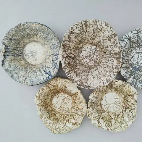 Cluster of small crackle-glazed dishes
