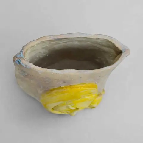 Small bowl with a yellow glaze accent