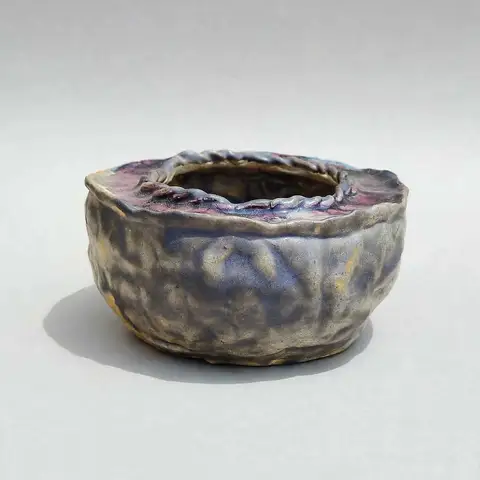 Rope-rim pot with reactive purple glaze