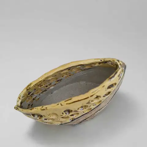 Gold perforated boat-shaped dish