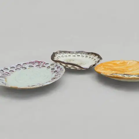 Trio of small decorative plates