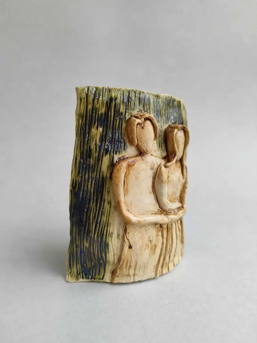 Companions Relief Plaque, two embracing figures in relief